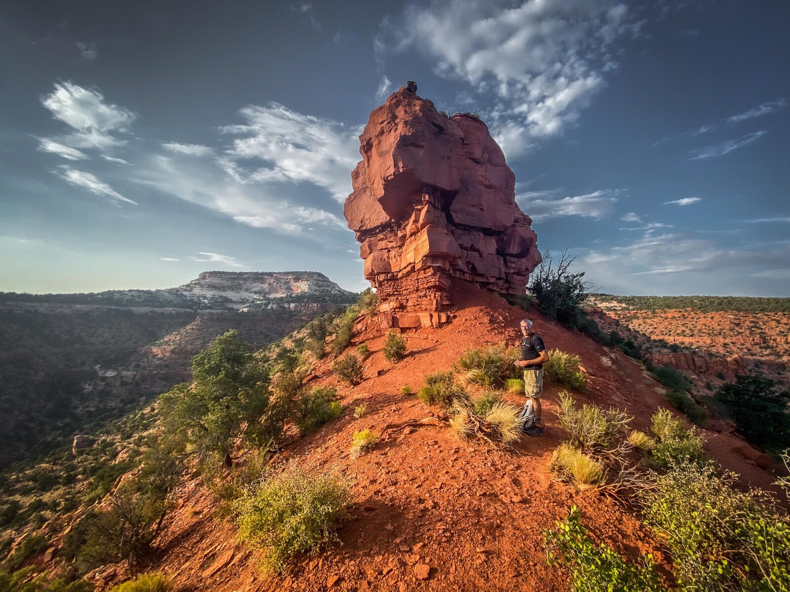 A tower of red Vermilion Cliffs sandstone against a deep blue sky above Kanab