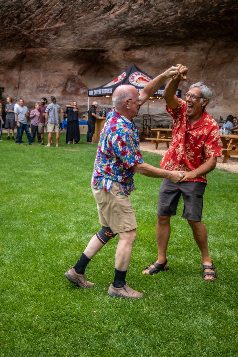 Two guests dancing on the lawn at Dreamland's 20th anniversary party in 2021